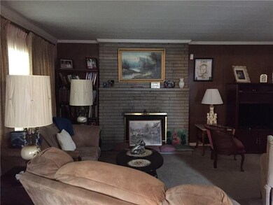 Livingroom with two picture windows and wood burni