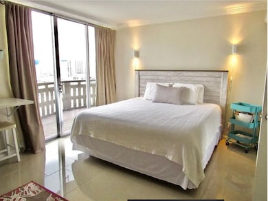 Bedroom with 3 closets and access to the balcony.