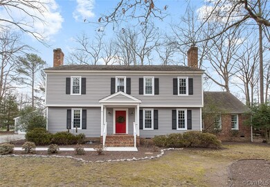 A classic Colonial with newer windows and vinyl si