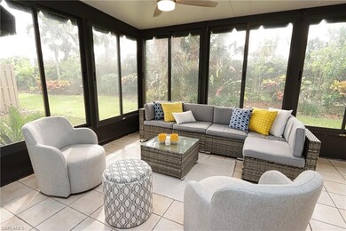 Sunroom with plenty of natural light and ceiling fan