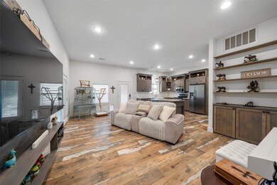 Custom cabinets abound throughout this open floor