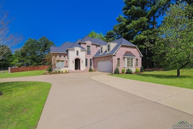 French country style house with brick siding, a fr
