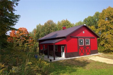 30' x 40' Cleary Pole Building w/12' door height w/porch lean to! Concrete floor. No power.