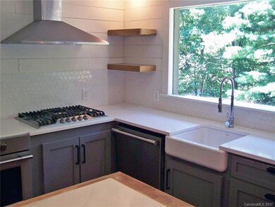 Farm sink, gas stove, corian counters