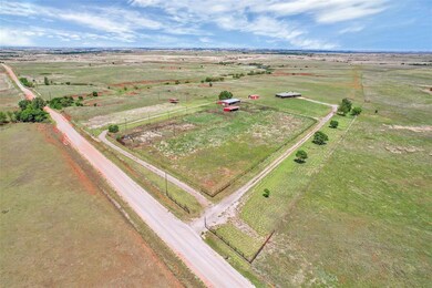 Birds eye view of property with a rural view