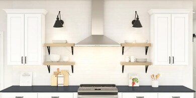 Kitchen with stainless steel hood and full backsplash