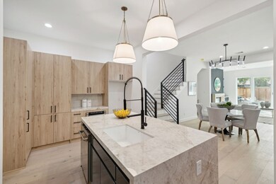 Custom cabinetry adds texture and warmth to the cl