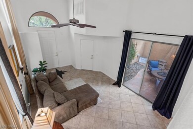 Tall vaulted ceilings complete with a ceiling fan.