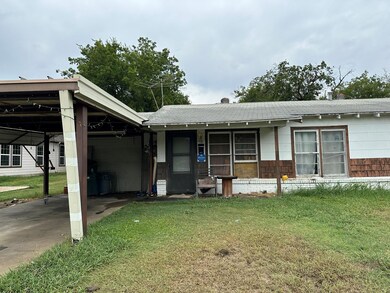 View of carport and garage