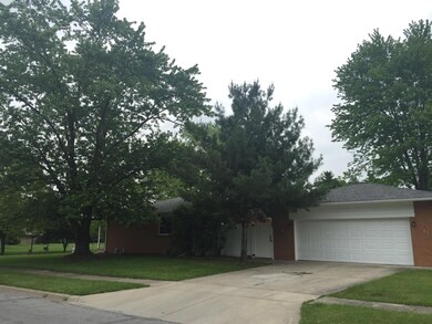 SIDE AND GARAGE VIEW OF HOME