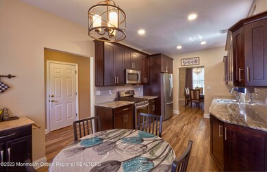 Kitchen is spacious and gives access to the dining room.