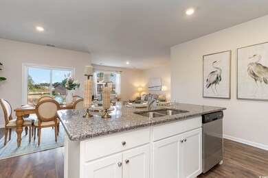 Kitchen featuring stainless steel dishwasher, base