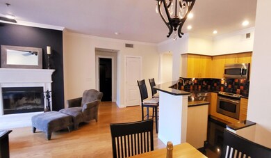 Kitchen with oven, dark countertops, visible vents