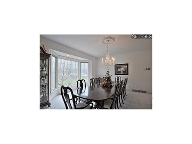 Formal dining room has attractive bay window and a