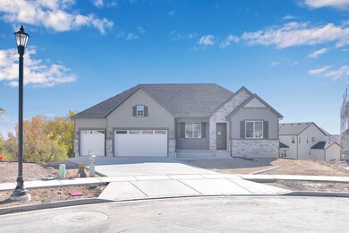 View of front of home with stone siding, concrete driveway, and roof with shingles
