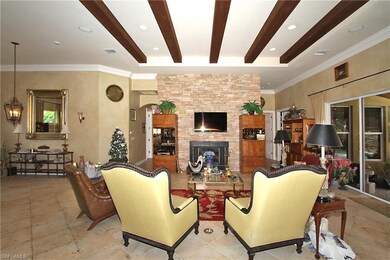 Great Room greets you with the lovely stone firepl