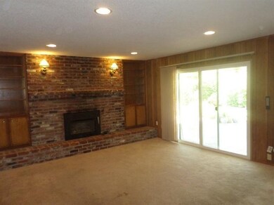 Family Room. Recessed lighting and slider out to c
