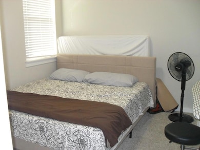 Bedroom featuring carpet