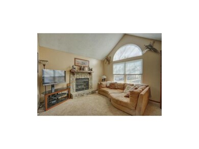 Great room w/ gas stone fireplace.