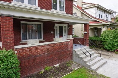 This home features brand new cement front steps, a