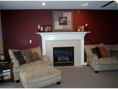 Marple faced gas fireplace is the focal point in t