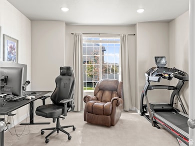 Home office featuring carpet flooring and recessed lighting