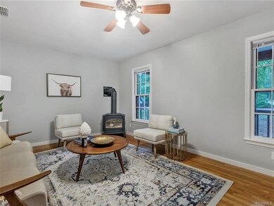 Another view of family room with cozy woodstove an