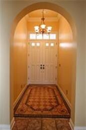 A new solid mahogany double door welcomes you insi