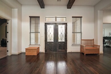 The Foyer features 12' Ceiling with Gorgeous Wood Beams