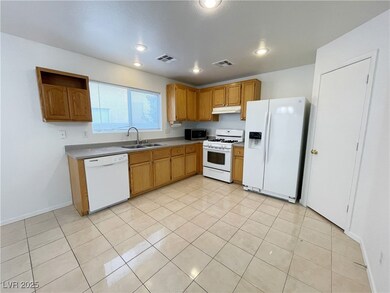 Kitchen with under cabinet range hood, visible ven