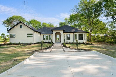 View of front facade featuring a front yard, a shi
