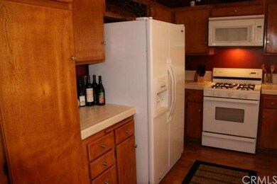 Tall pantry with lots of shelves on left of photo.