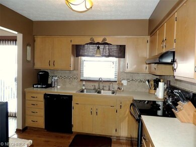 Kitchen with laminate wood flooring, refinished ca