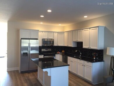 Kitchen with granite and subway tiles