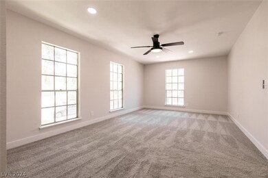 Large bright primary bedroom, w/new carpet and cei