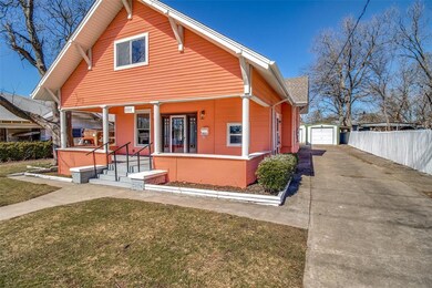 1111 E Houston with driveway and garage(s)