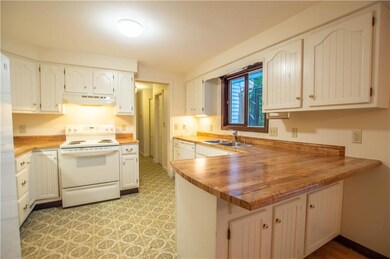 An airy and inviting kitchen bathed...