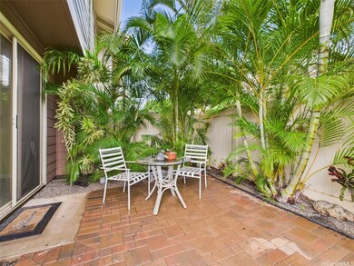 A beautifully landscaped backyard with lush green