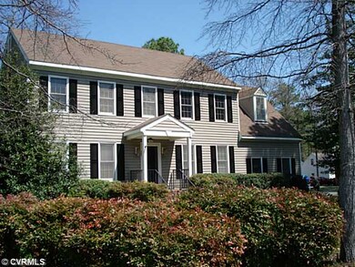 Exterior Front - Well landscaped corner lot.