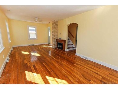 Large living area with freshly finished hardwood f