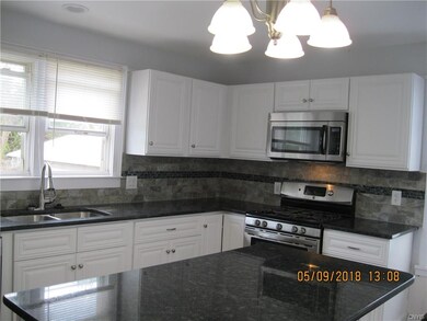 Beautiful granite counter tops, ceramic tile back 