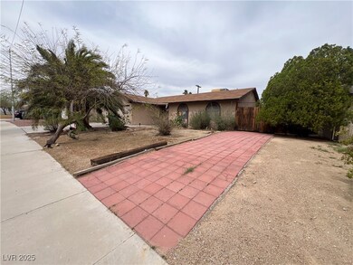 View of front of house with stucco siding and fenc