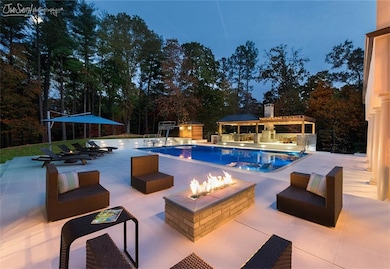 Evening view of pool and entertaining area.