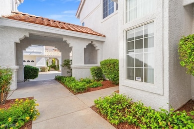 Property entrance featuring stucco siding and a ti
