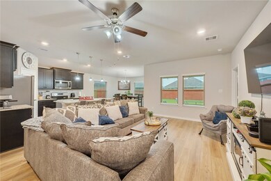 Living area with light wood-style floors, ceiling