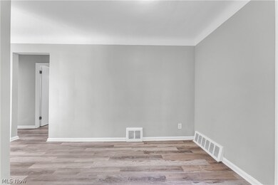 Unfurnished room featuring light wood-type flooring