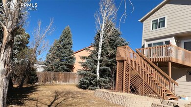 View of yard with a wooden deck