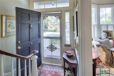 Enter foyer from covered stoop and screened door.