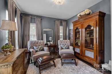 13'x12' Office/Flex Space  at front of home.  Custom-made curtains in this room only remain.