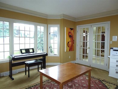 Living room with French doors & bump-out bay windo